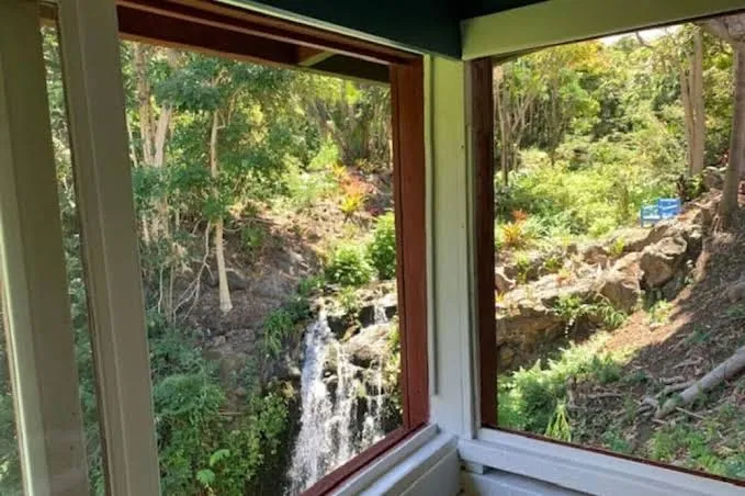 Romantic waterfall cabin in the rain forest, Hawaiian Islands exterior view
