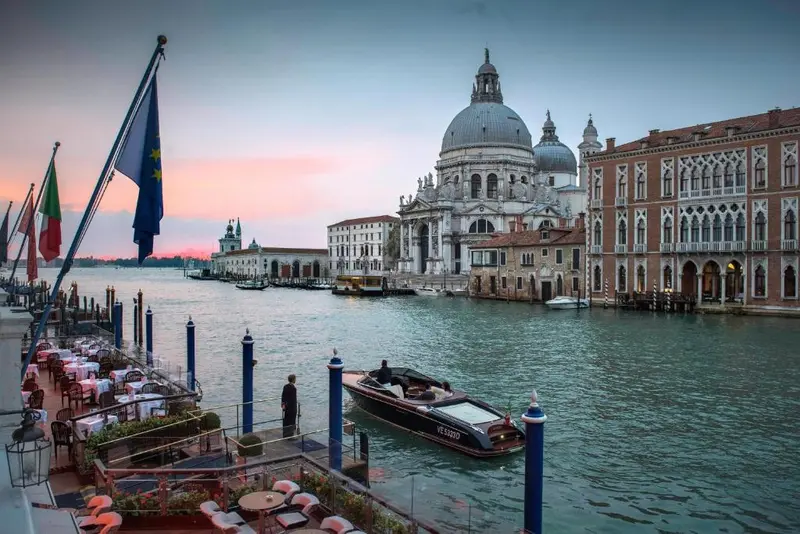 Gritti Palace hotel facade on the Grand Canal with gondolas, Venice